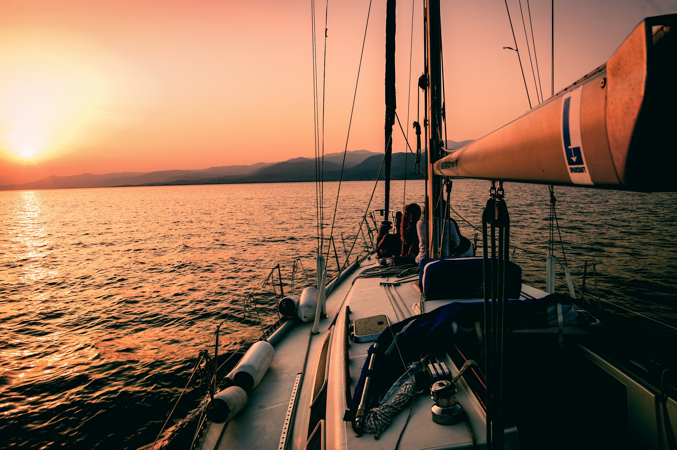 View from a sailing yacht's deck at sunset