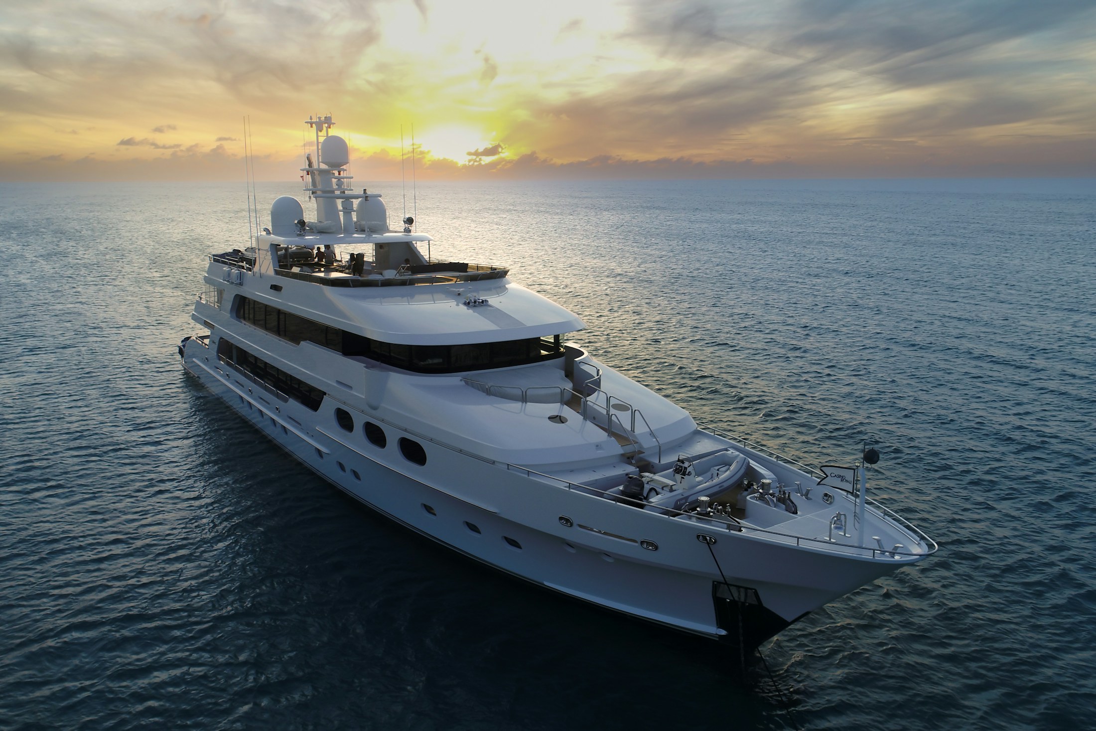 A private yacht crossing the sea in warm evening light